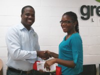Mr. Keilan Johnson - Sales Manager at Green Dot (left), Mrs. Christophe-Branche - Winner of One Month Free Digital Cable TV (right)