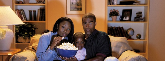 african-family-watching-television